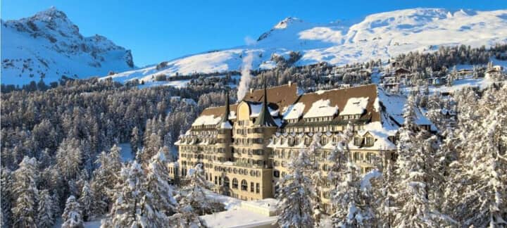 Ski-in, ski-out resort exterior with direct mountain access and forest views