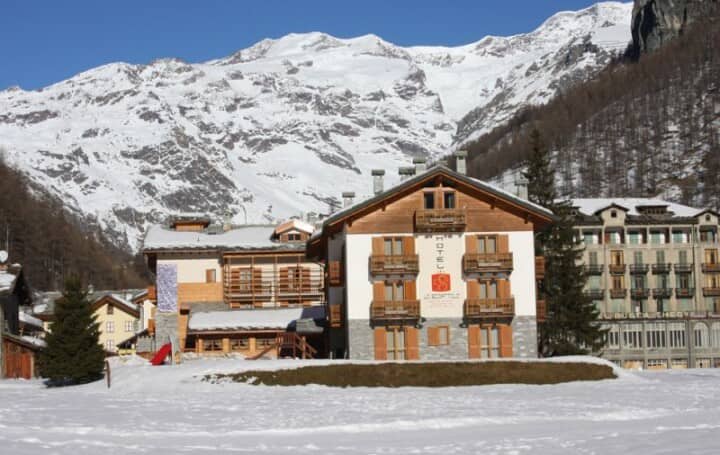 Chalet exterior with private balconies and direct snow-front access