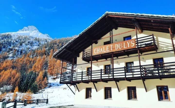 Chalet exterior featuring private wrap-around balconies with mountain and forest views