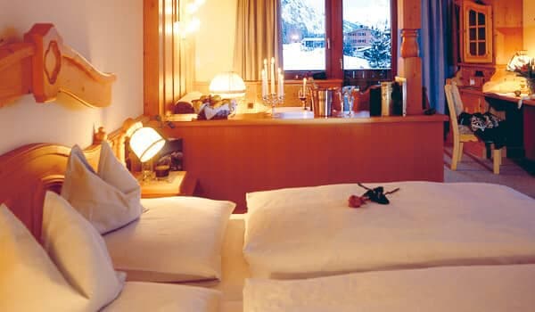 Bedroom with dual twin beds and integrated workspace featuring mountain views