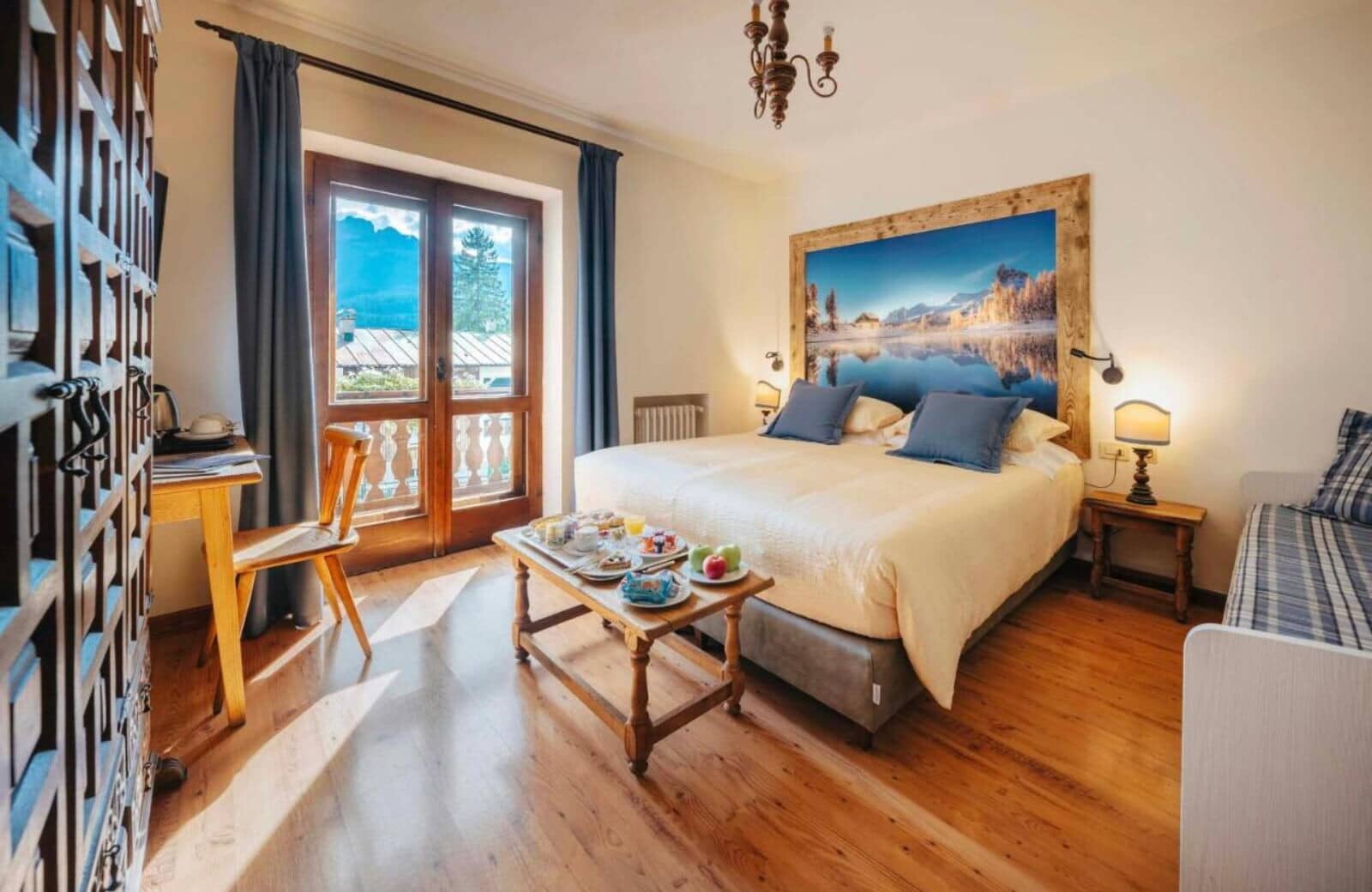 Guest bedroom with king bed and private balcony access