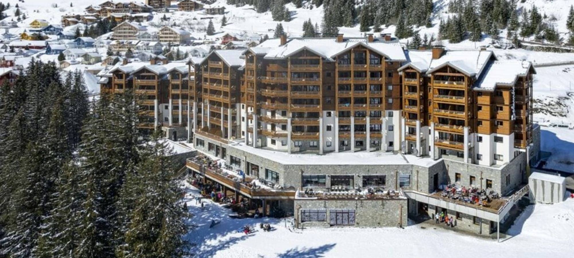 Ski-in resort with tiered outdoor terraces and private balconies