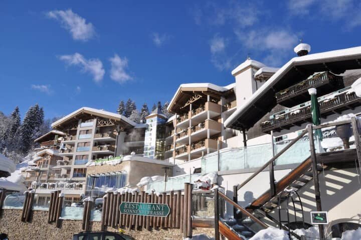 Ski-in/ski-out resort exterior with on-site restaurant and sun terrace
