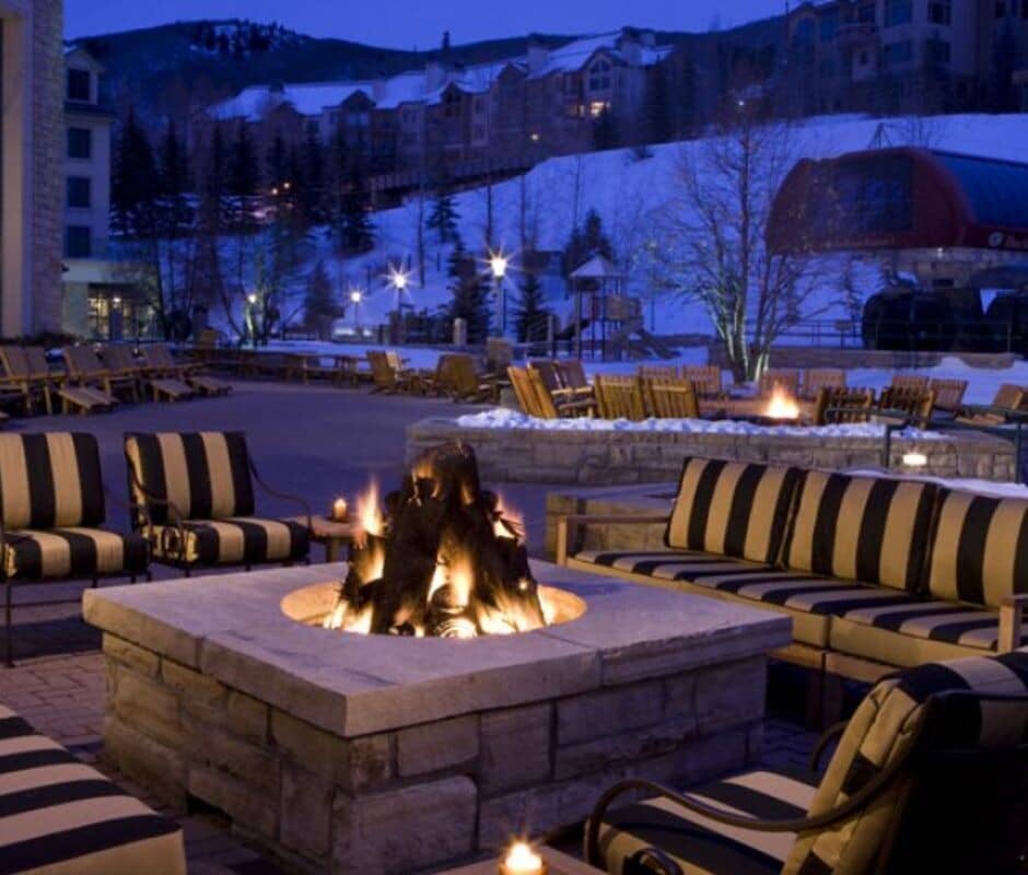 Shared outdoor fire pit with lounge seating and ski resort views
