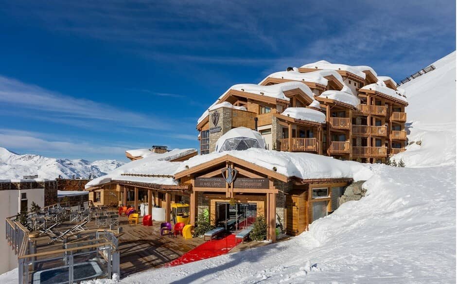Ski-in, ski-out chalet entrance with sun terrace and mountain views