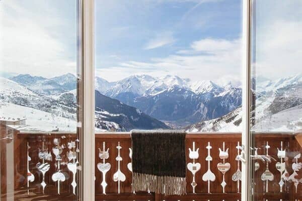 Private balcony with glass doors and panoramic French Alp views