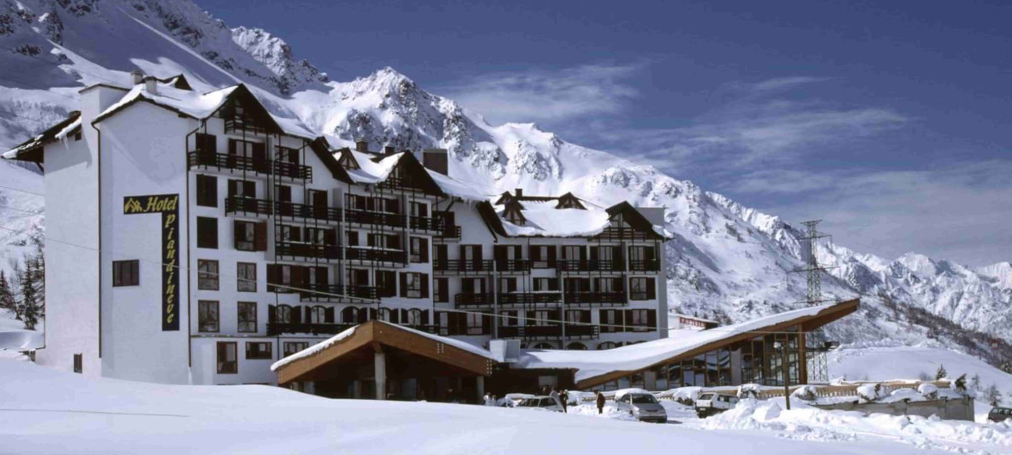 Ski-in/ski-out hotel exterior with private balconies and mountain views