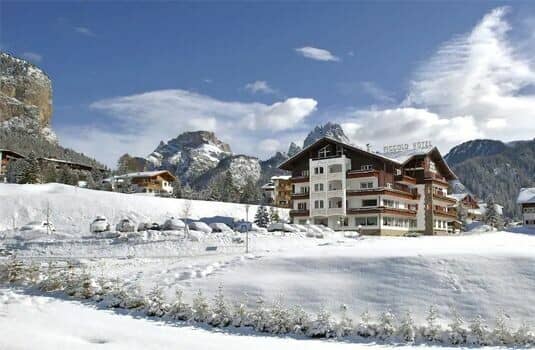 Alpine lodge exterior with private balconies and onsite parking