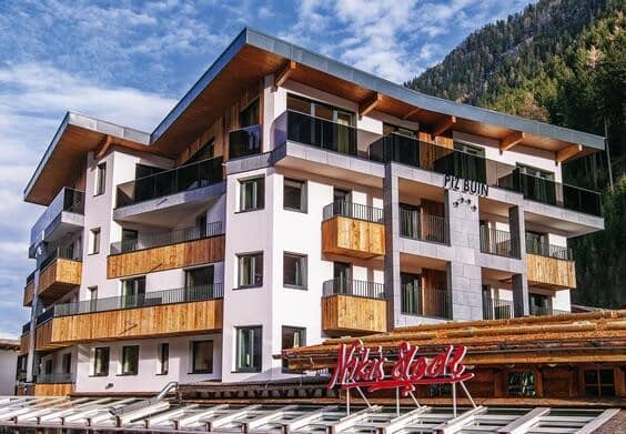 Chalet exterior with private balconies and mountain-facing views