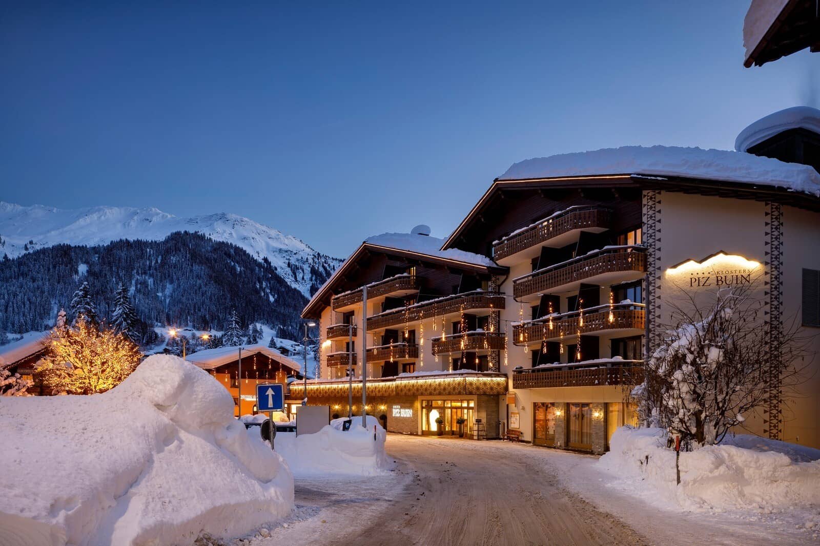 Ski-in/ski-out hotel exterior with private balconies and mountain views