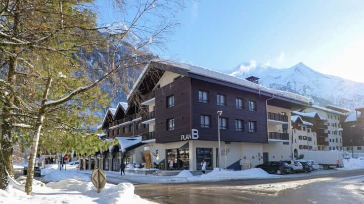 Chalet exterior with mountain views and street-level commercial space