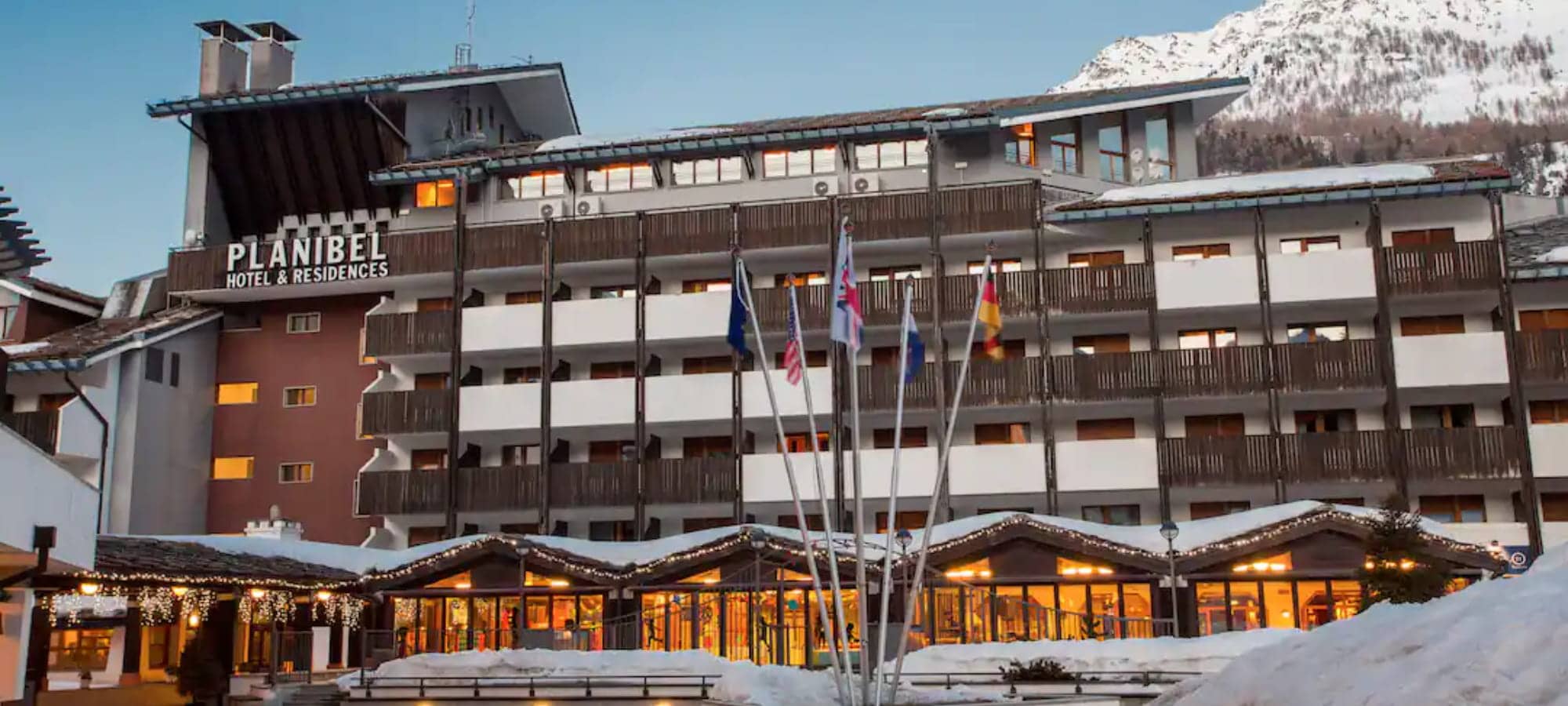 Planibel Hotel & Residences exterior with private balconies and mountain views