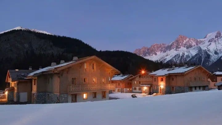 Ski-in/ski-out chalet exterior with direct slope access and mountain views
