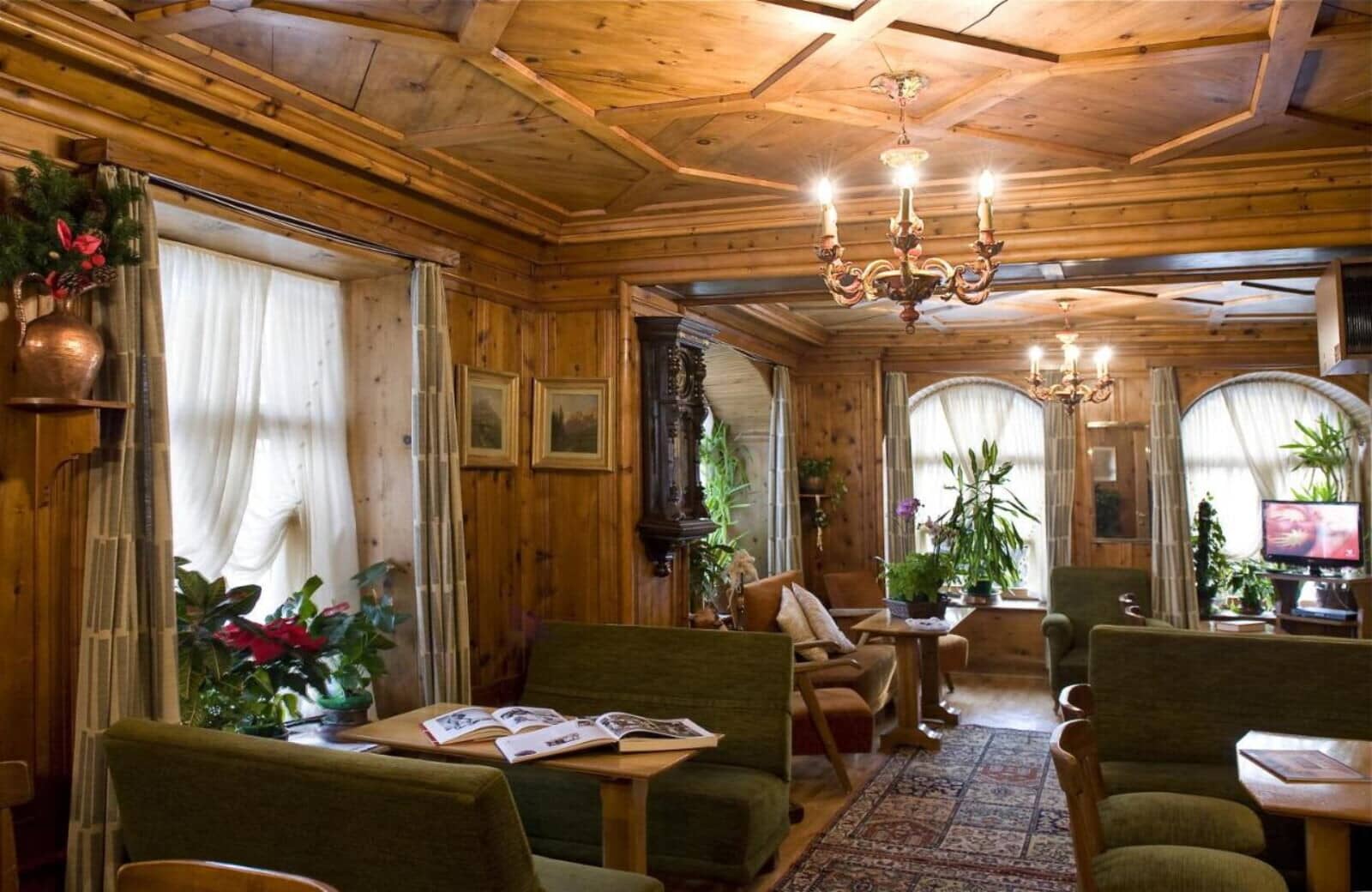 Lounge area with coffered wood ceiling and original pine paneling