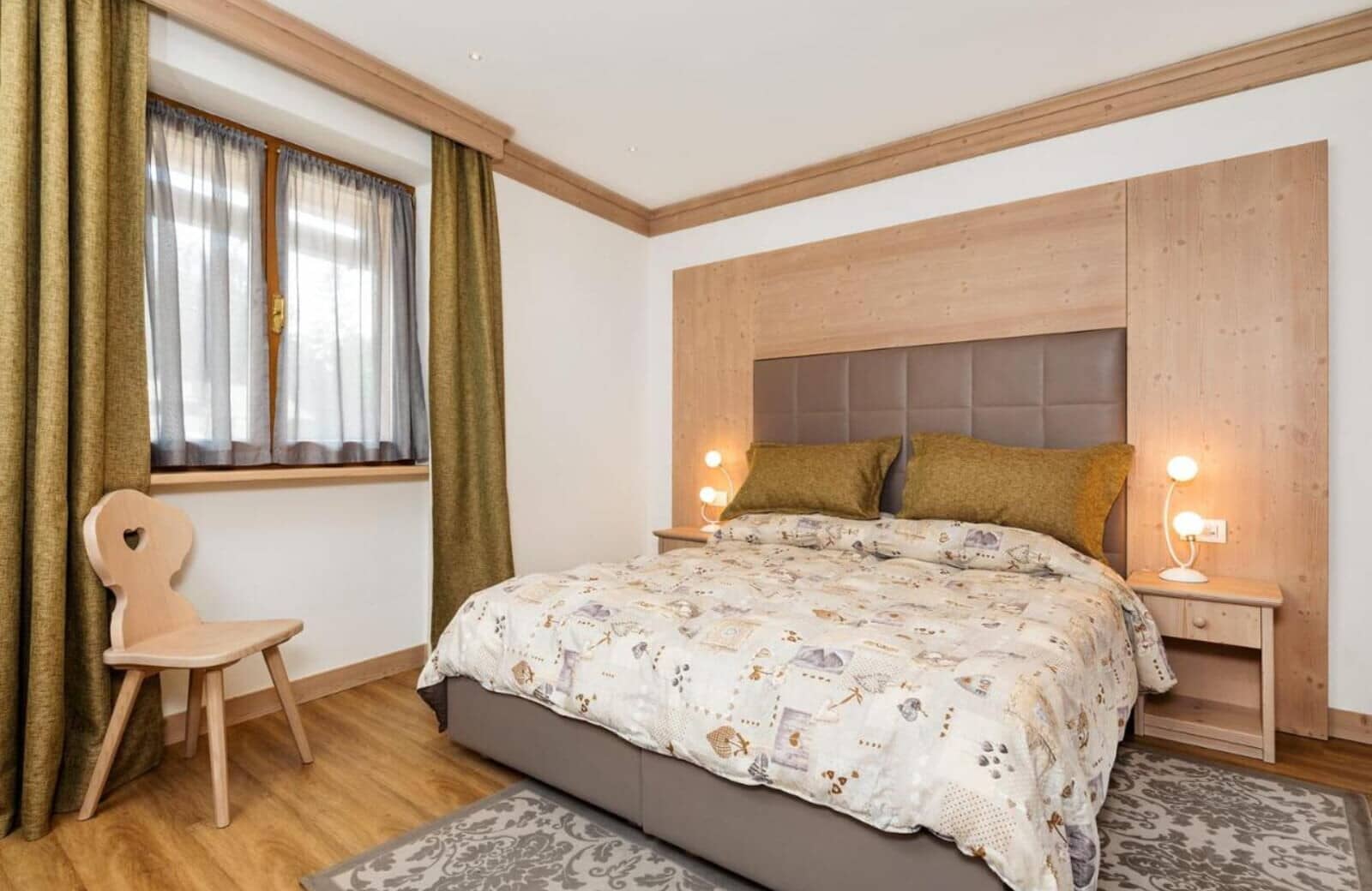 Guest bedroom with king bed and light wood finishes