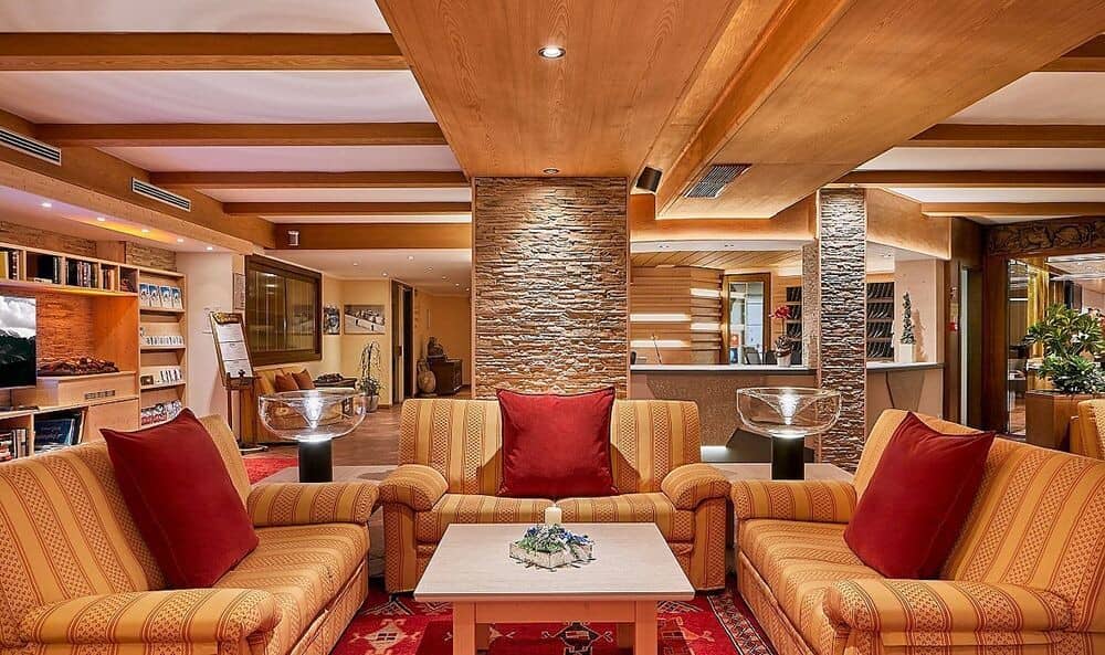 Lobby lounge with stone accents and reception desk access