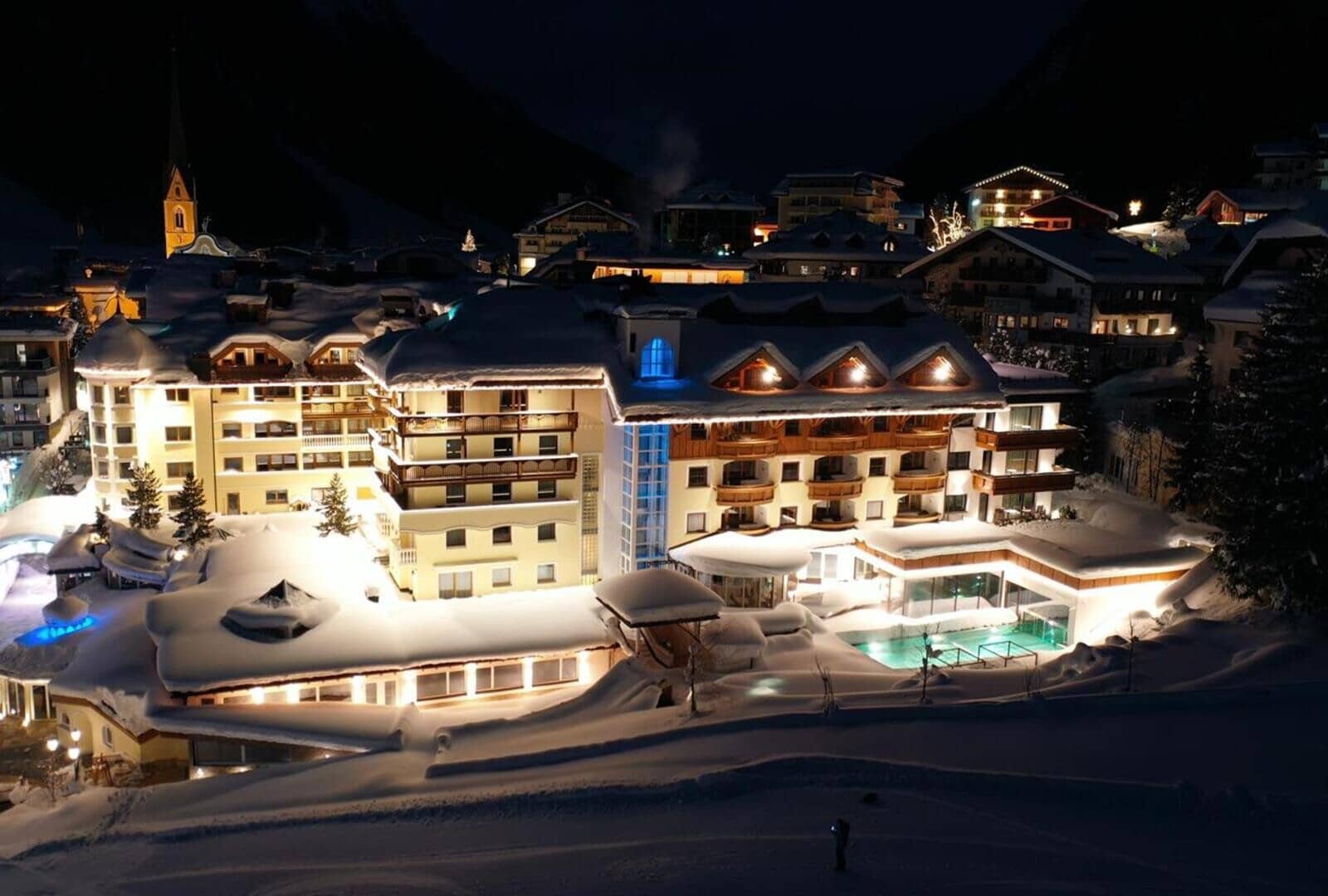 Ski-in/ski-out resort exterior with heated indoor-outdoor pool