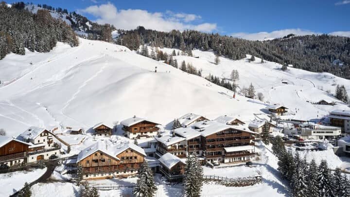Slope-side chalet exterior with direct access to ski runs and lifts