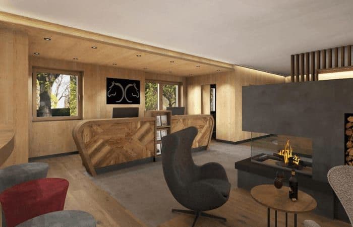 Lobby with concierge desk and gas fireplace seating area