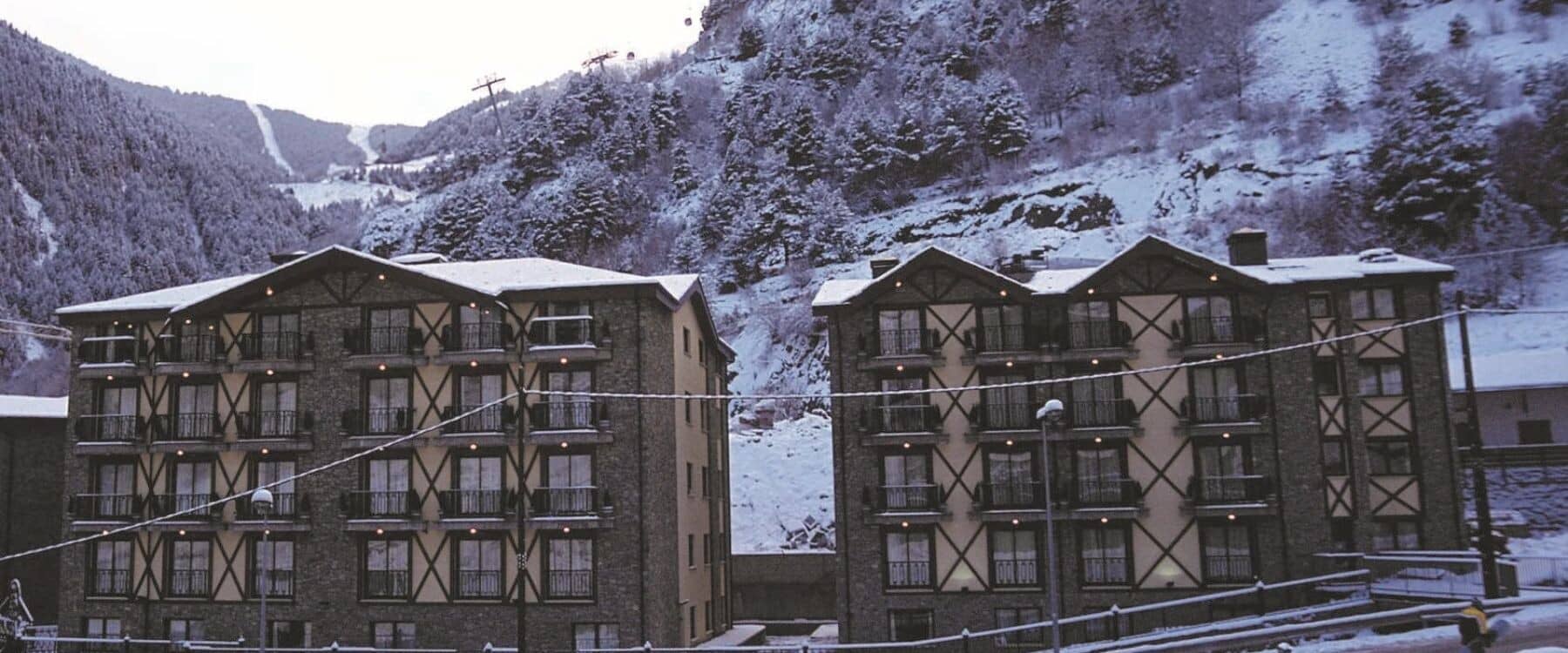 Building exterior with private balconies and direct view of ski lift