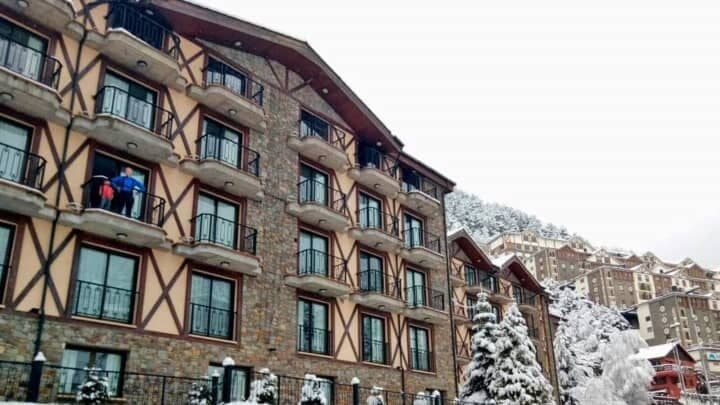 Ski-in, ski-out resort exterior with private balconies and mountain views