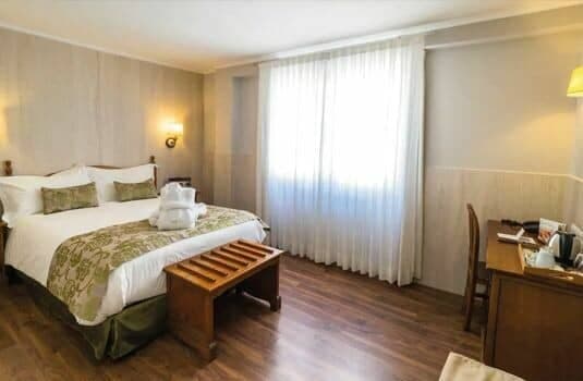 Guest bedroom with queen bed and dedicated work desk