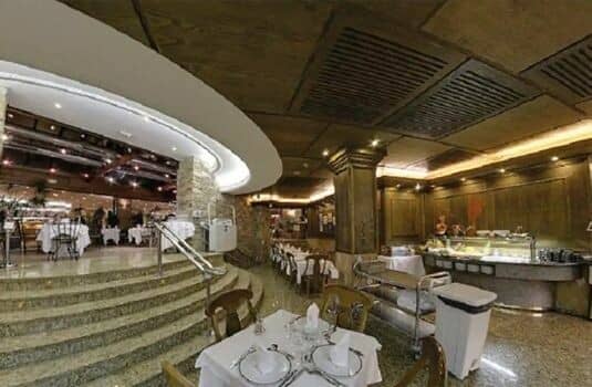 Dining area with buffet station and table seating on two levels