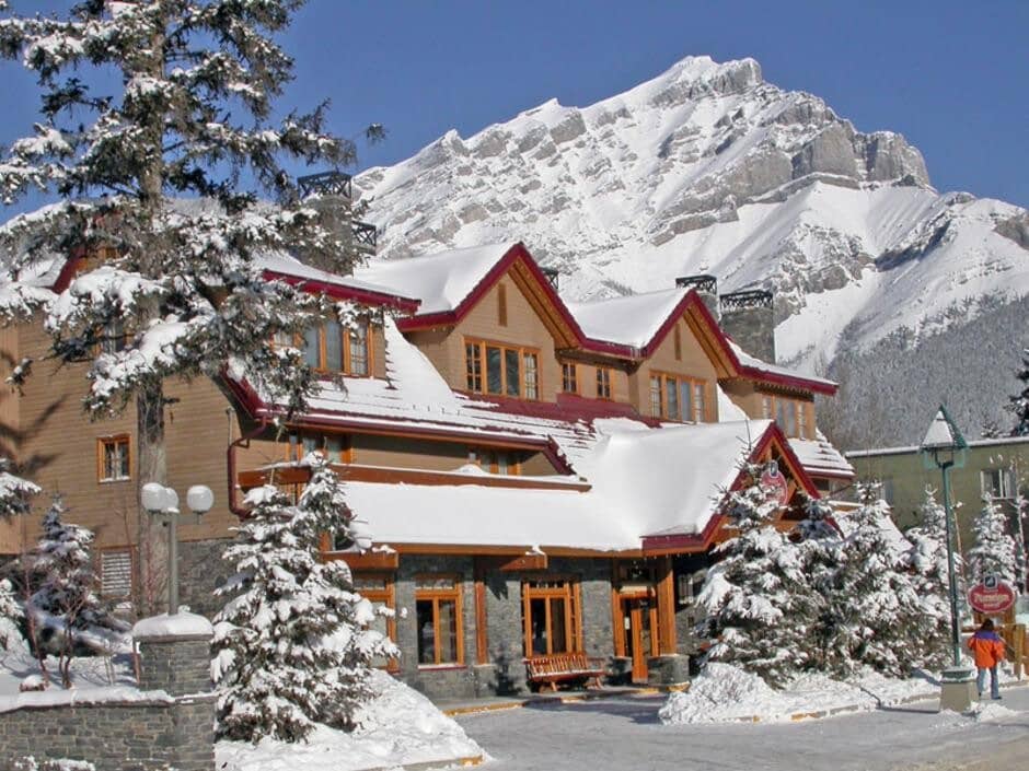 Lodge exterior with stone accents and direct mountain views