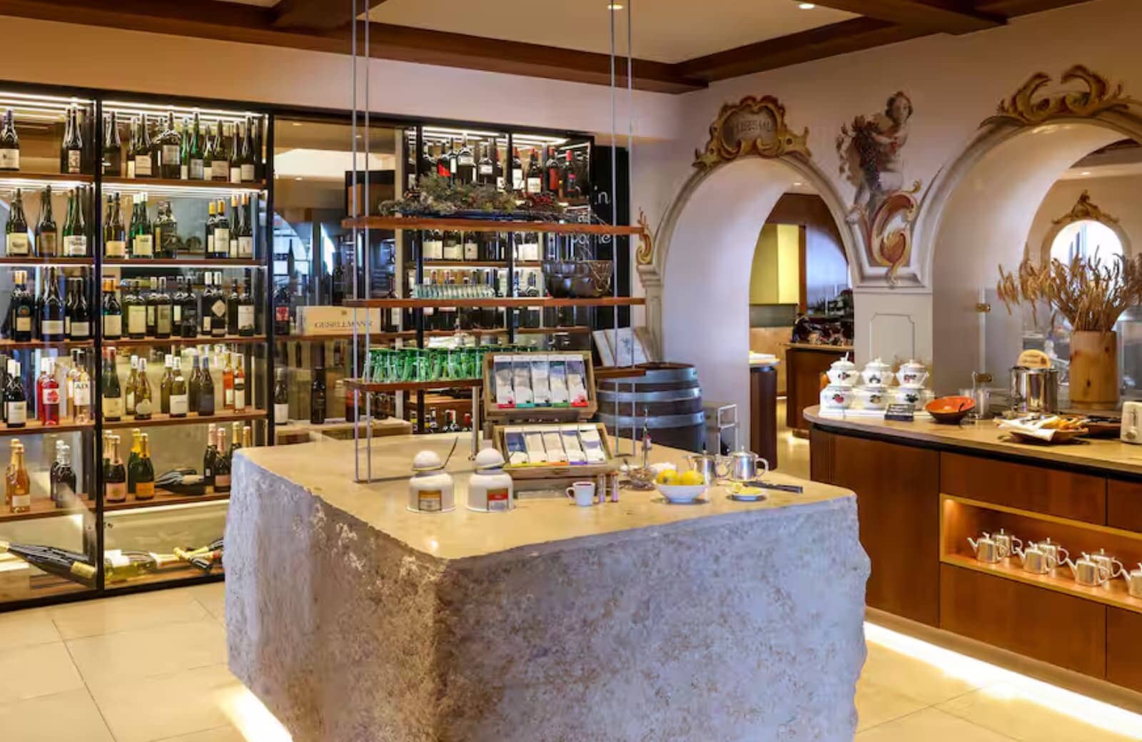Wine cellar and tasting room featuring a hand-carved stone island