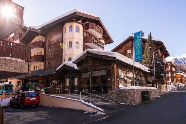 Chalet exterior featuring private balconies and ramp access to the entrance