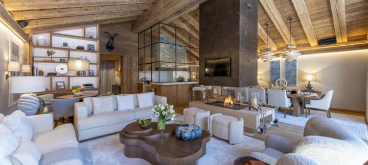 Open living area with double-sided gas fireplace and dining for 8