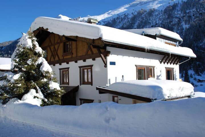 Chalet exterior with timber-frame details and mountain views