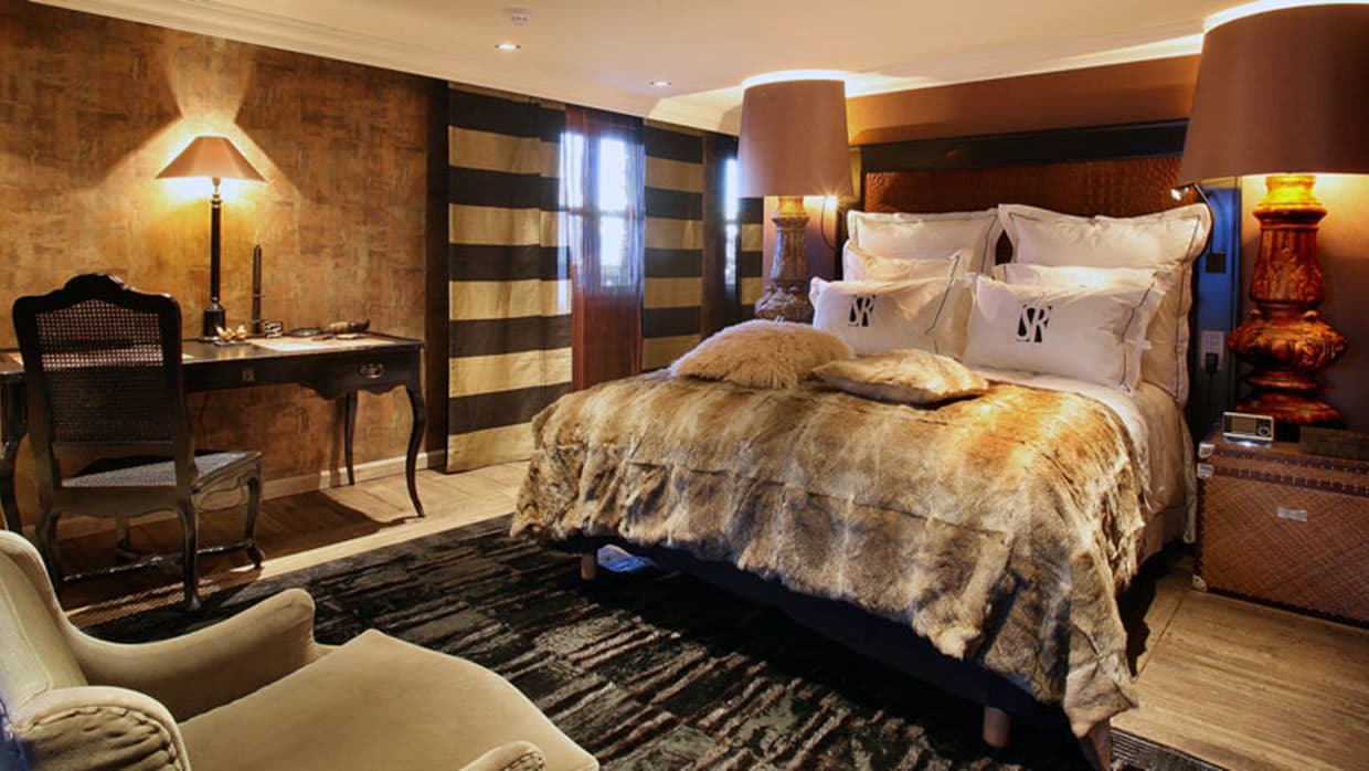 Primary bedroom with king bed and dedicated workspace desk