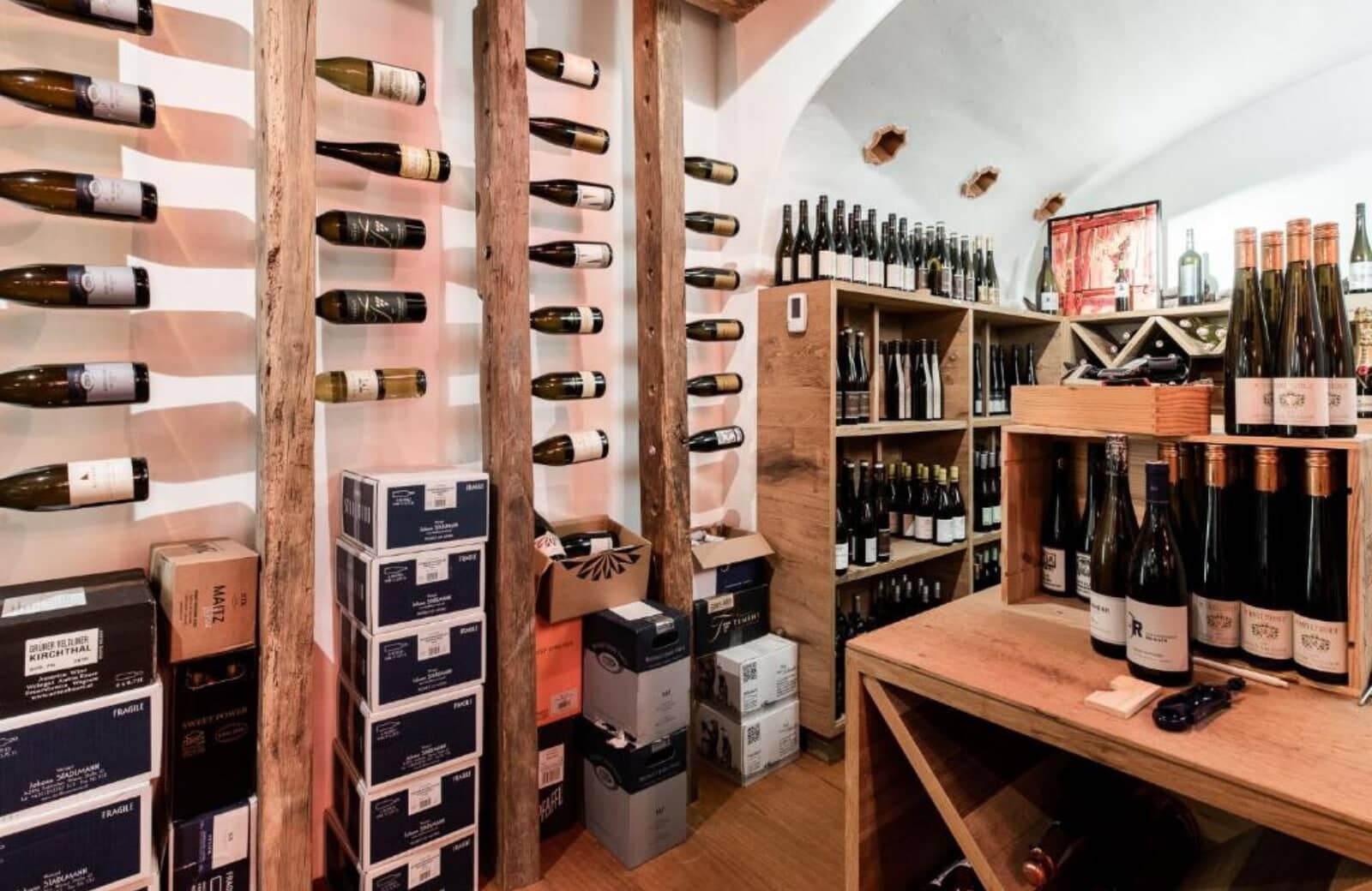 Wine cellar with vaulted ceiling and reclaimed wood racking