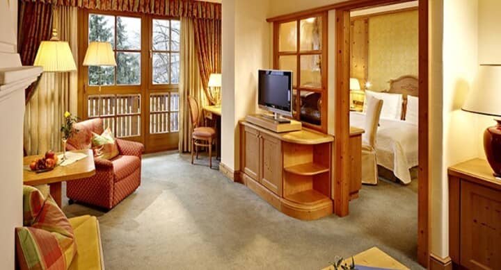 Living area with balcony access and separate bedroom