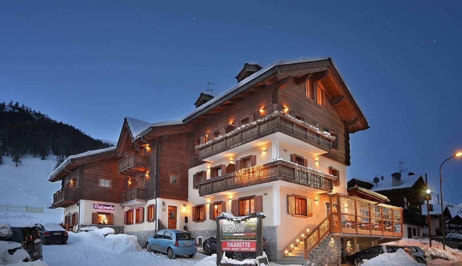 Chalet exterior at dusk with on-site restaurant and private parking