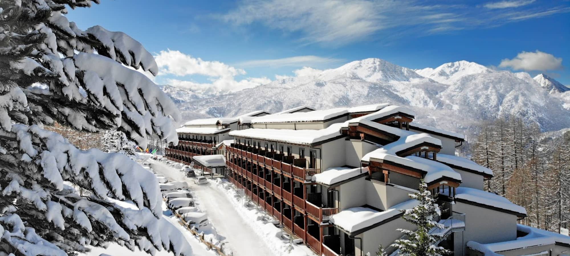 Ski-in/ski-out resort exterior with private balconies and mountain views