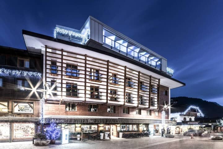 Chalet exterior featuring private balconies and penthouse terrace in central village location