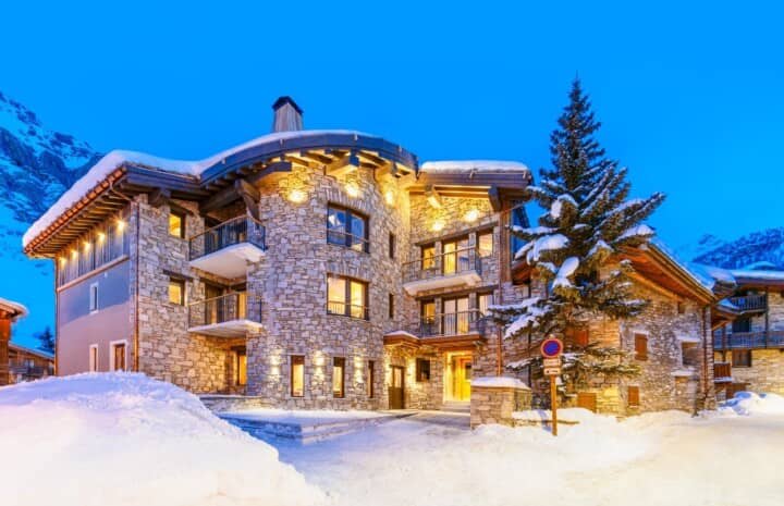 Ski-in, ski-out chalet with private balconies and stone facade