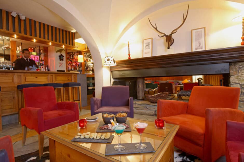 Lounge area with stone fireplace and walk-up bar service