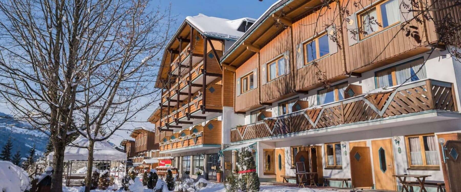 Chalet exterior featuring private timber balconies and mountain valley views