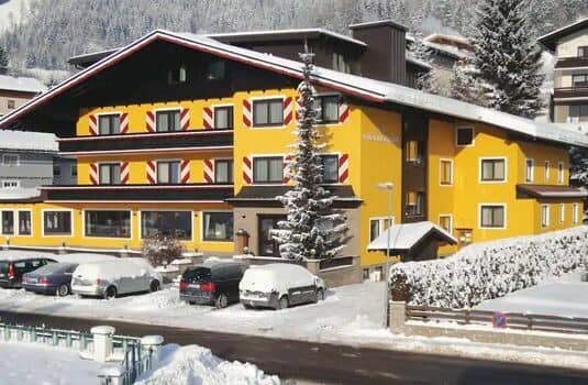 Chalet exterior with on-site parking and mountain views