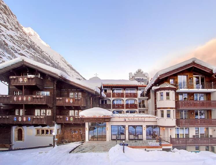 Ski-in/ski-out chalet with private balconies and mountain backdrop