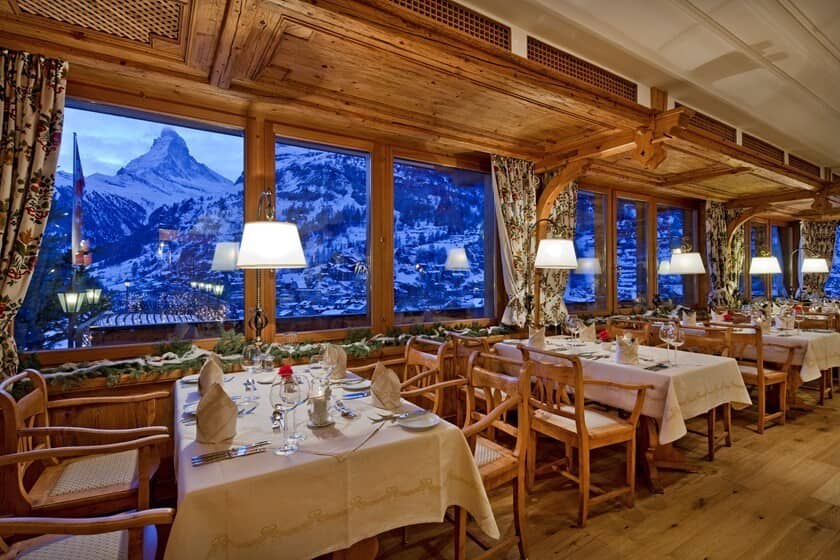 Dining area with Matterhorn views and traditional alpine wood paneling