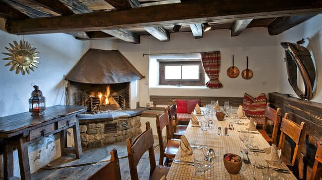 Dining room with wood-burning fireplace and seating for 10