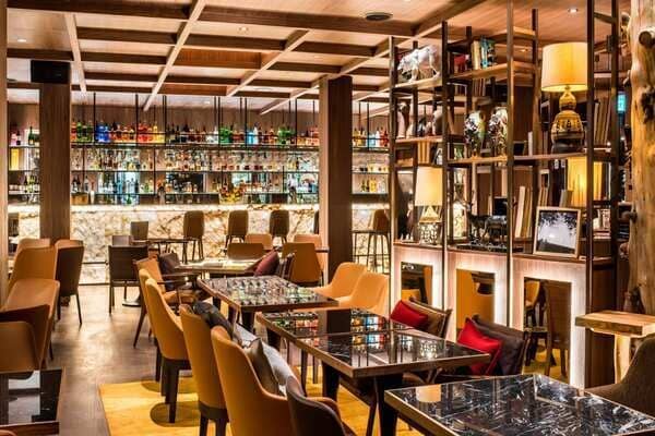 Resident lounge and cocktail bar with backlit marble counter