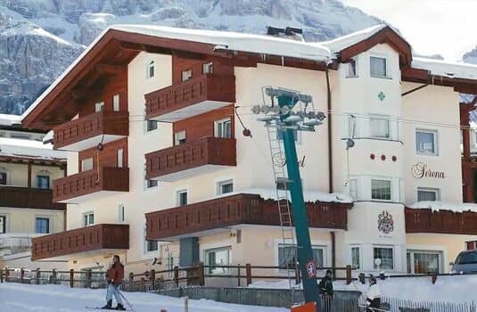 Ski-in/ski-out chalet exterior with private balconies and mountain views
