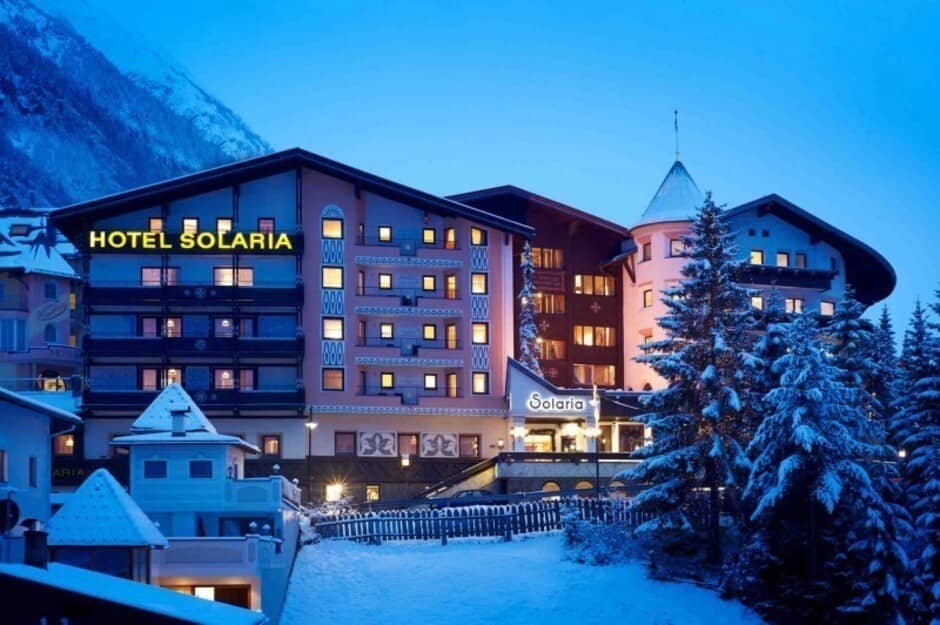 Hotel exterior featuring private balconies and snow-covered grounds