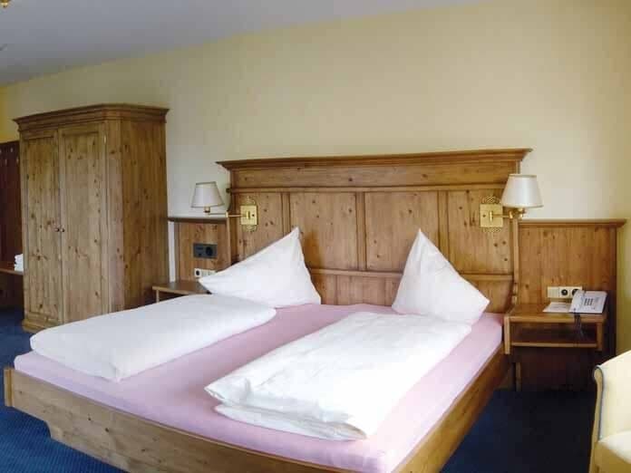 Bedroom with king bed and built-in bedside reading lamps