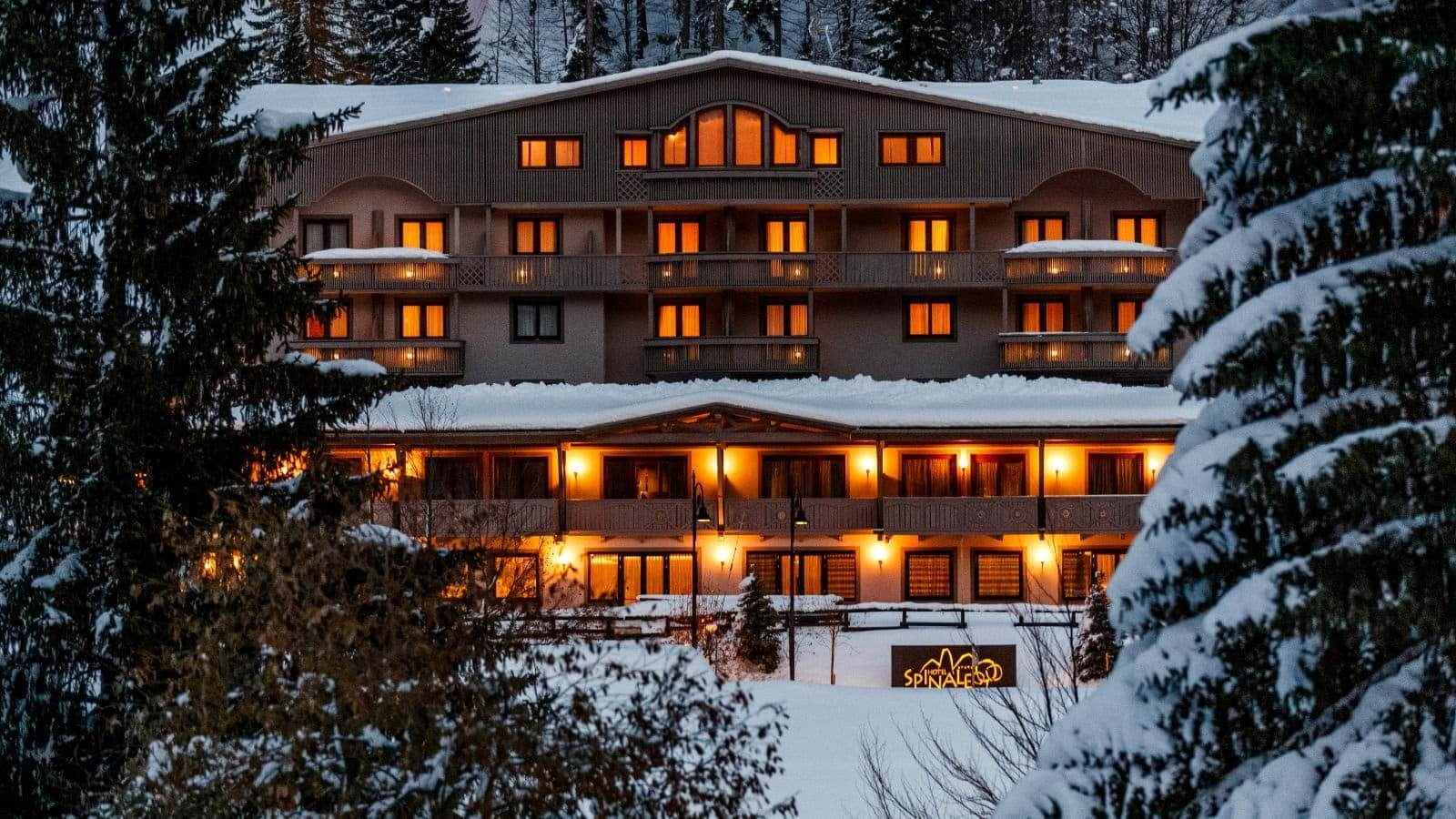 Ski-in/ski-out lodge exterior with private balconies and snow-covered grounds